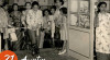 Foto Sekretaris Kabinet Maria Ulfah Santoso menggunting pita di Paviliun Persatuan Wanita Jakarta Raya pada pembukaan Pekan Raya Ekonomi Internasional, 21 Agustus 1954.
